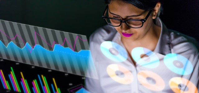 Latina businesswoman looking at various business information Latina businesswoman looking at various business information